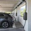 Power and data cables supplying a row of EV charge points in an office car park Power and data cables supplying a row of EV charge points in an office car park