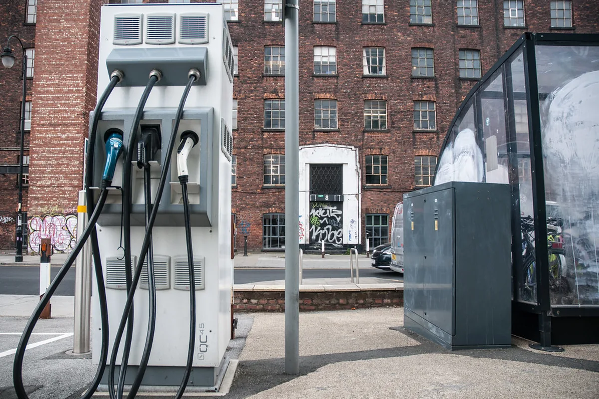 Rapid DC charging unit with its feeder cabinet on an urban street, the kind of installation where FG16(O)R16 single-core cables carry DC power