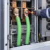 Single-core DC power cables connected to busbars inside a high-power EV charging cabinet Single-core DC power cables connected to busbars inside a high-power EV charging cabinet