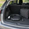 Portable EV charging lead coiled in a car boot