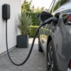 AC charging cable with a Type 2 connector charging an electric car at home AC charging cable with a Type 2 connector charging an electric car at home