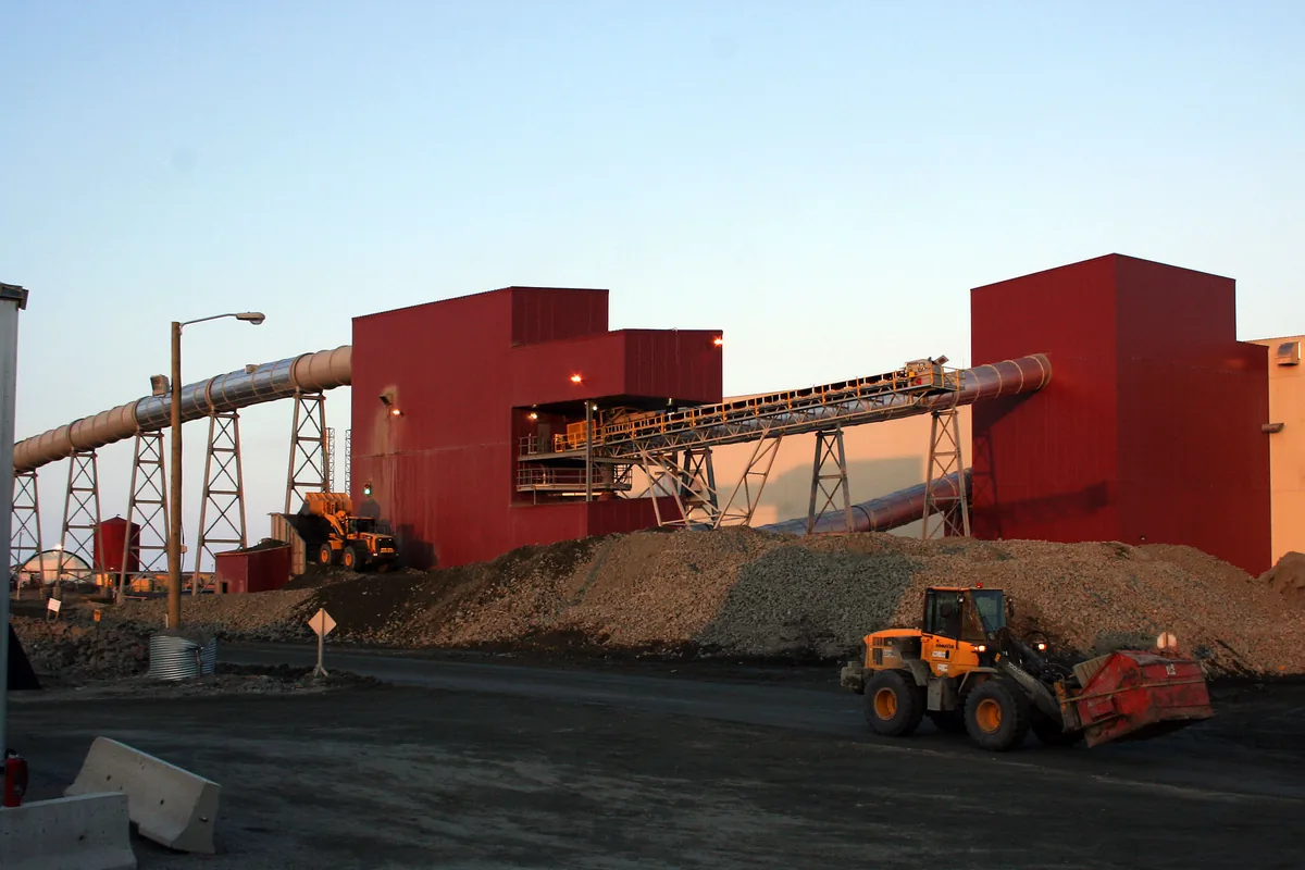 Processing plant buildings and conveyor galleries at a mine site, where crushers, conveyors and pumps are fed at 3.3 kV through armoured screened cables such as MGM 112 Type 331