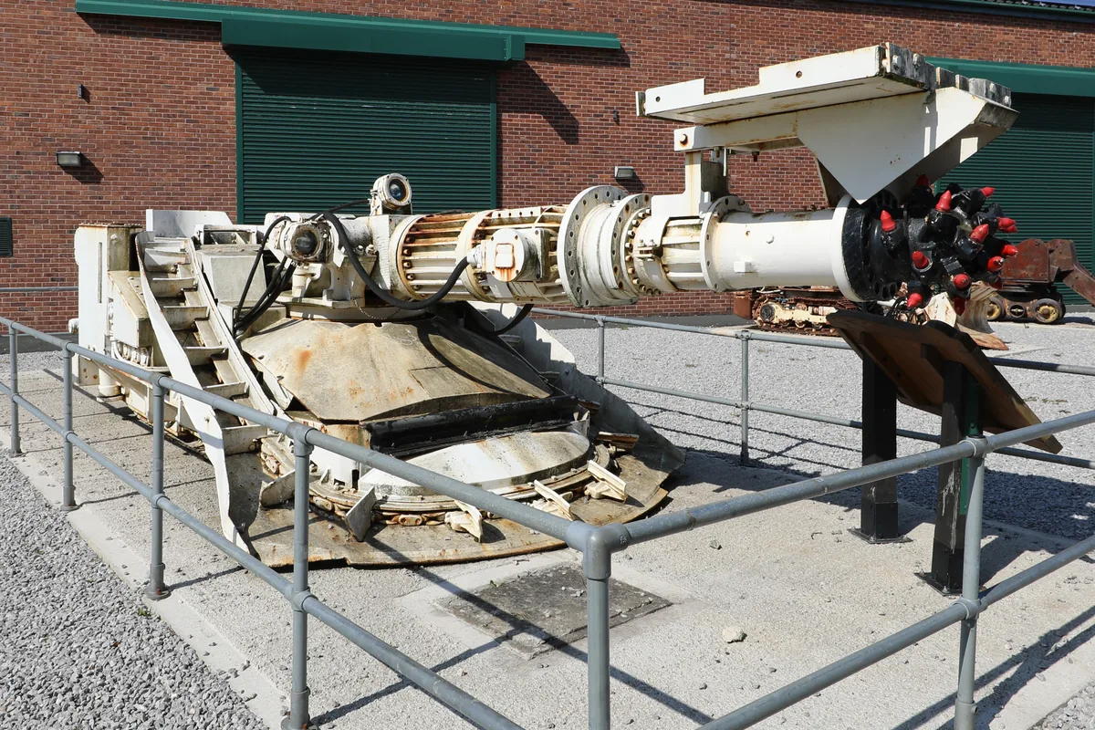 Preserved roadheader with its cutting boom and cutter head, a heavy mining machine of the type supplied by an MGM 115 Type 7S trailing cable with pilot cores