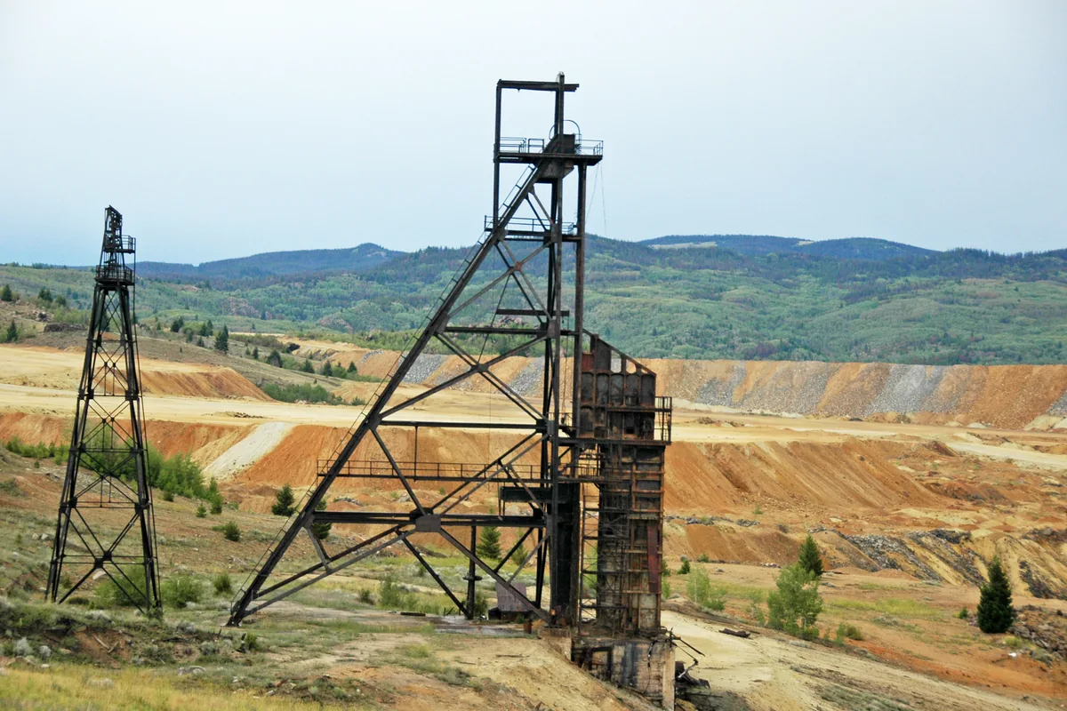 Steel mine shaft headframe above an underground mine, where power for the workings is carried down by heavily armoured cables such as MGM 118 Type 6020