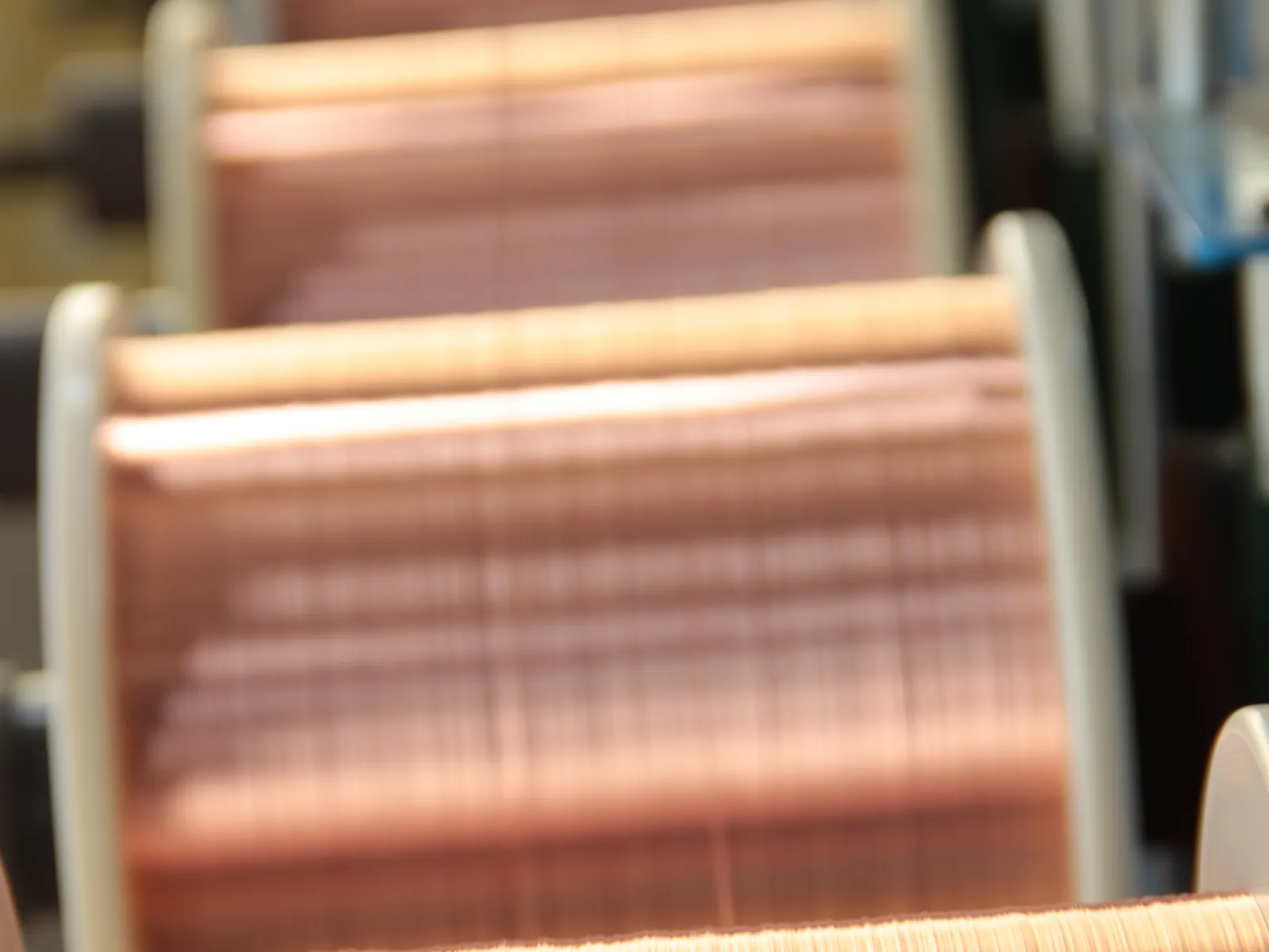 Bare copper wire bobbins inspected before stranding at the TEBAOFLEX factory