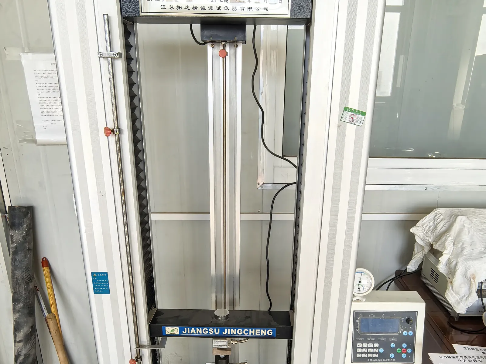 Tensile testing machine for conductor and sheath samples