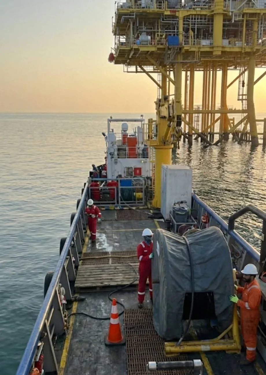 Offshore oil and gas platform at sunset