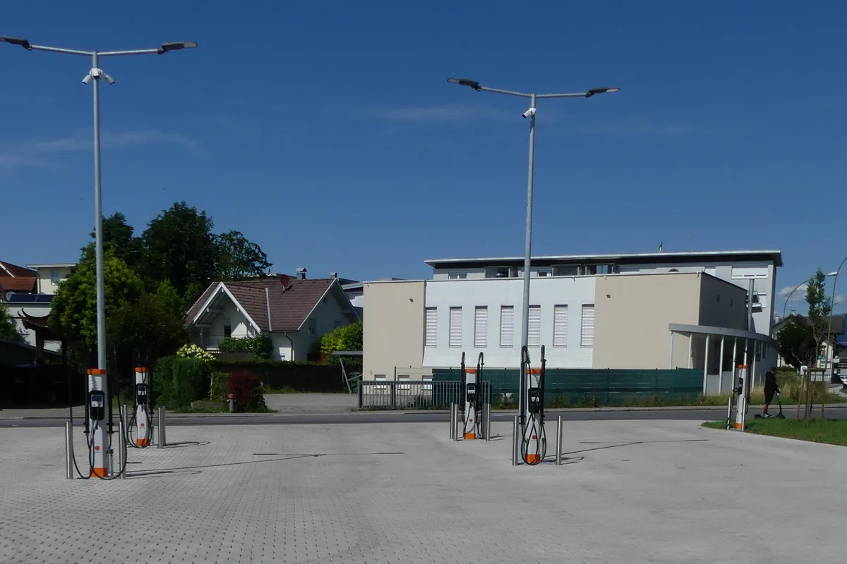 Charging posts with their flexible charging cables hanging from the holders at an open bus charging park, the duty an S1BZ5-F DC charging cable is built for